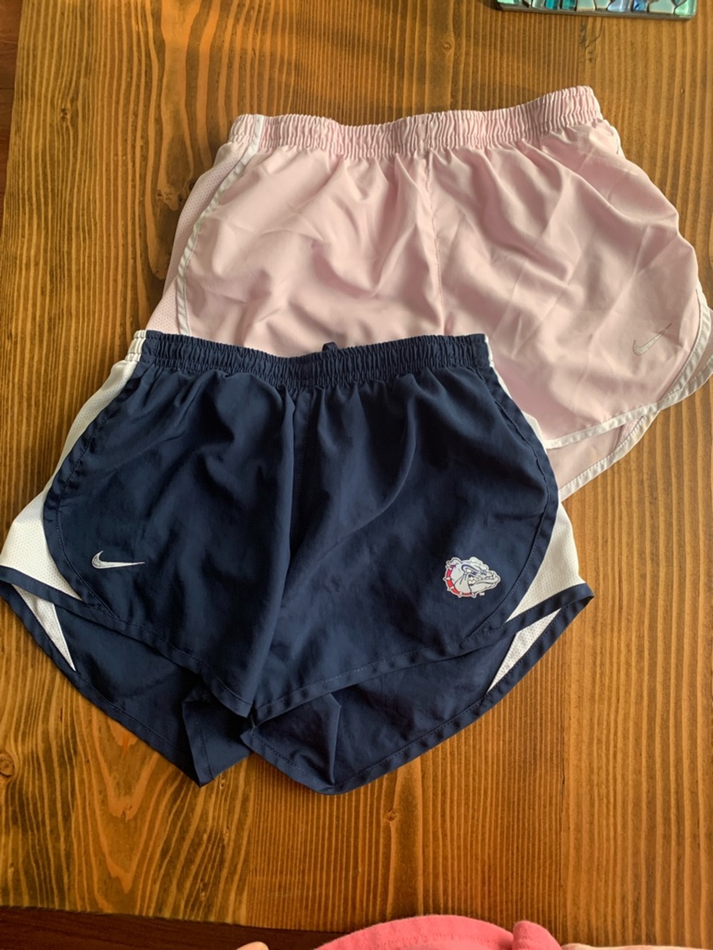 2 pairs of Nike shorts pink and navy blue